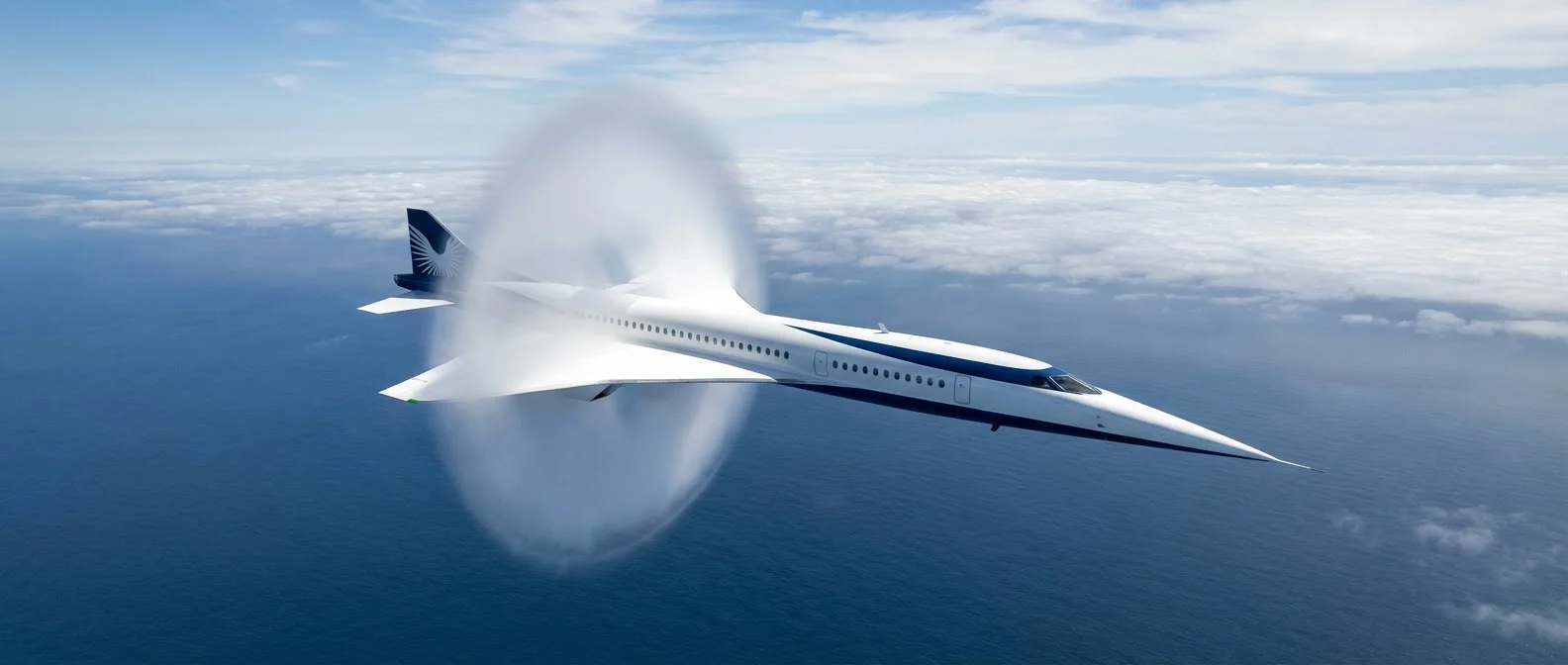 Boom Overture supersonic aircraft flying at Mach 1.7 speed above clouds