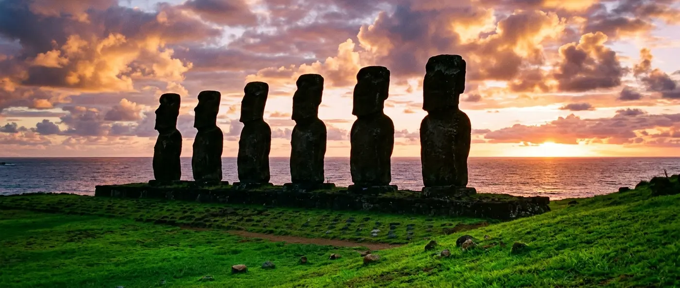 Nearly 1,000 Moai statues standing on Easter Island's grassy landscape